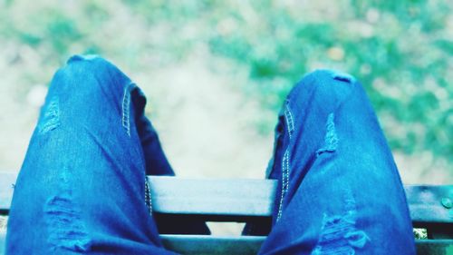 Low section of man relaxing outdoors