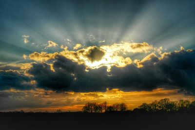 Scenic view of landscape against cloudy sky