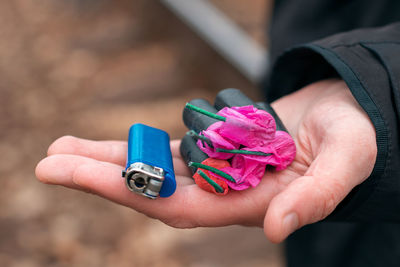 Close-up of woman holding multi colored hand