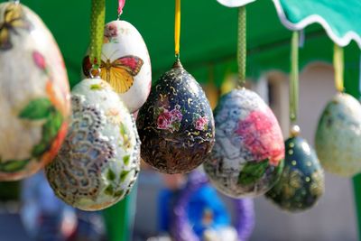 Close-up of colorful easter eggs hanging at market