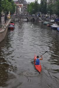 Man rowing boat in river