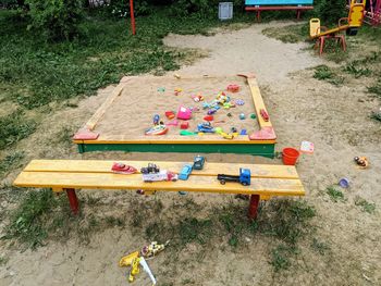 High angle view of toy on bench in park