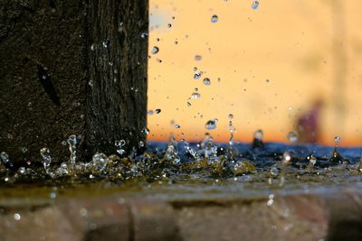 Close-up of drops splashing on fountain