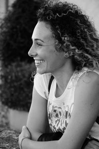 Portrait of smiling young woman looking away