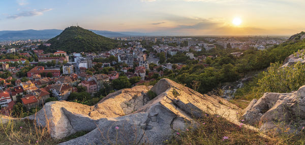 Panoramic view of townscape against sky during sunset