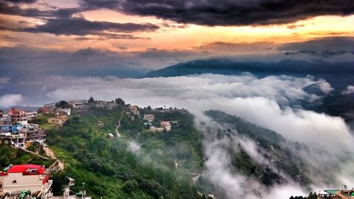 Scenic view of town against sky