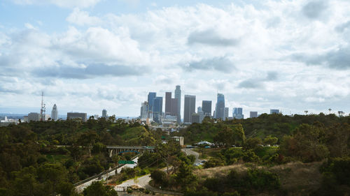 Modern buildings in city against sky