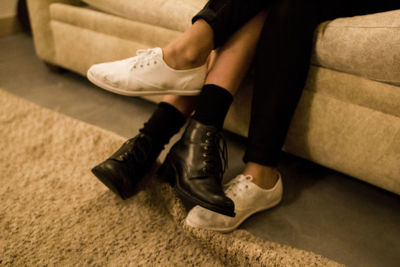 Low section of man sitting on sofa