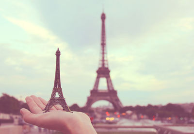 Hand holding french souvenir in paris