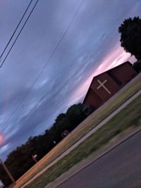 Low angle view of building and trees against sky