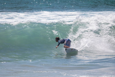 Man surfing in sea