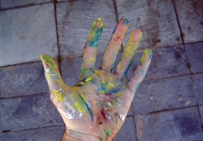 High angle view of multi colored human hand