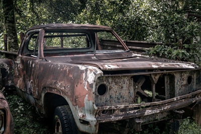 Abandoned car on field