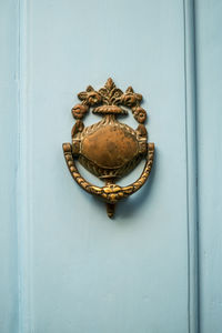 Close-up of door knocker on wall