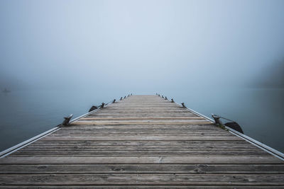 Pier over sea against sky