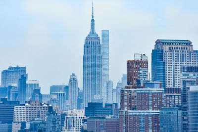 Modern buildings in city against sky