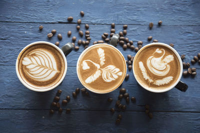 High angle view of coffee served on table