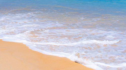 High angle view of waves rushing towards shore