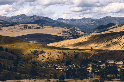 Scenic view of landscape and mountains against sky
