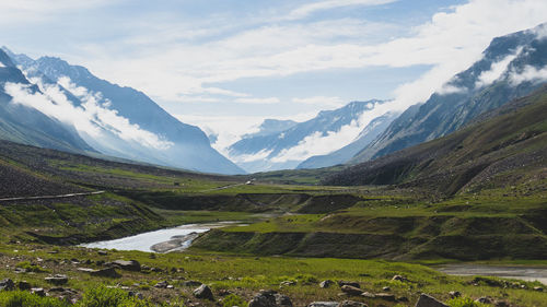 Scenic view of landscape and mountains against sky