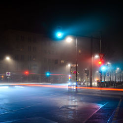 Light trails on road in city at night