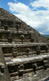 Built structure against cloudy sky