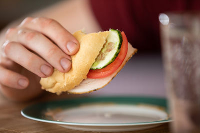 Cropped hand of person holding food