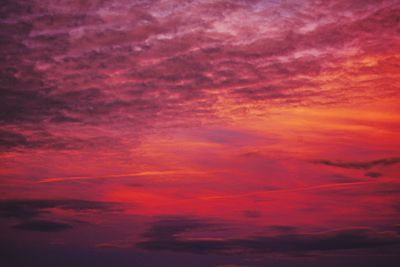 Low angle view of dramatic sky during sunset