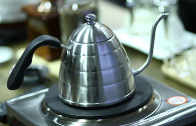 Close-up of tea kettle on stove in kitchen