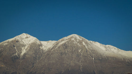 Monte velino, abruzzo italy.  apennines.  mountain range with snowy peaks and blue sky.