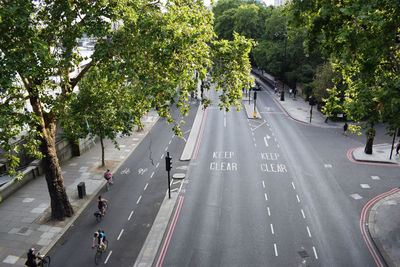 High angle view of people walking on road