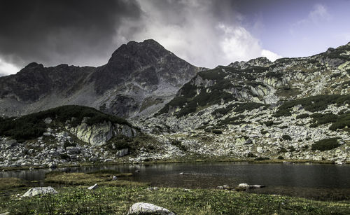 Scenic view of lake and mountains against sky