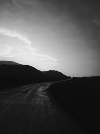 Road amidst landscape against sky