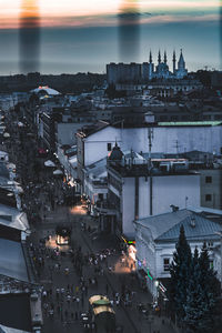 High angle view of illuminated city buildings at dusk