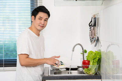 Portrait of young woman working at home