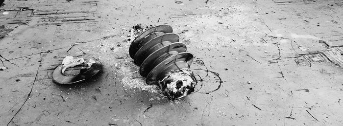 High angle view of old shoes on sand