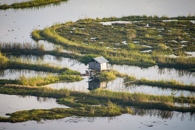 Scenic view of lake and the fisherman's hut.