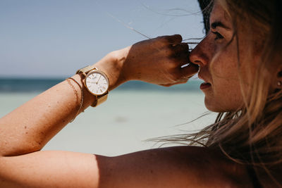 Close-up portrait of woman on beach