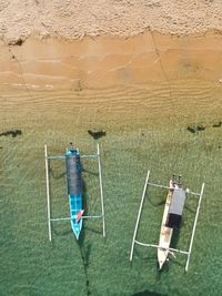 Ariel view of sandy beach and boats 