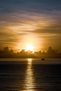 Scenic view of sea against sky during sunrise