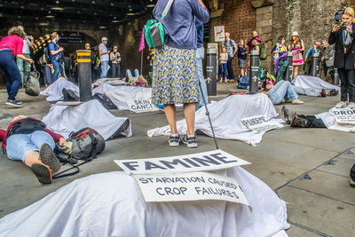 Rear view of people walking on street