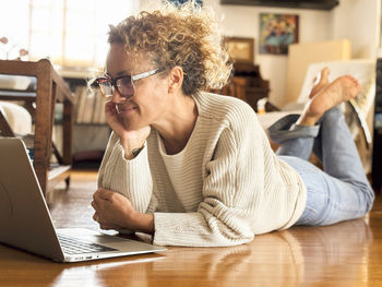 Young man using laptop at home