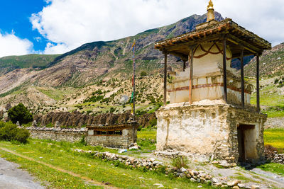 View of old building against cloudy sky