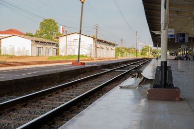 Train at railroad station against sky