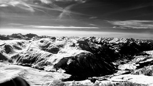 Scenic view of snowcapped mountains against sky