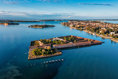 Flying over small venice islands in venetian lagoon.