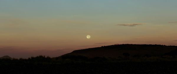 Scenic view of silhouette landscape against sky during sunset