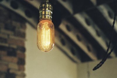 Low angle view of illuminated light bulb