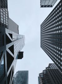 Low angle view of modern buildings against sky