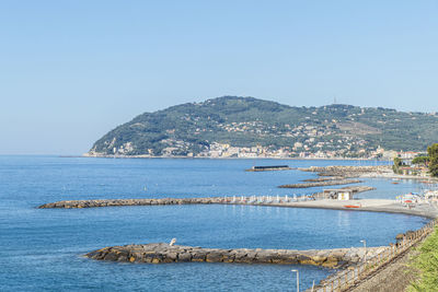 Scenic view of sea against clear blue sky